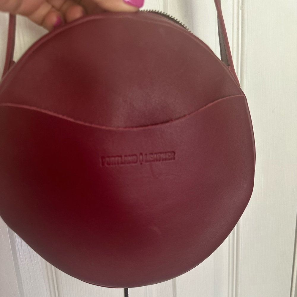 Circle crossbody from Portland Leather. Dark red color. Size Large.